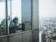 woman standing near window