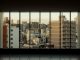 an empty room with a view of a city